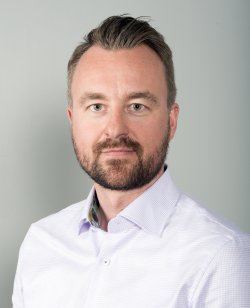 Portrettbilde av Pål Rune Eklo i hvit skjorte.